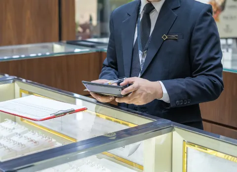 jeweler looking at jewelry certification