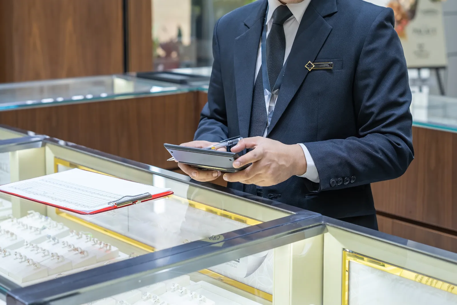 jeweler looking at jewelry certification