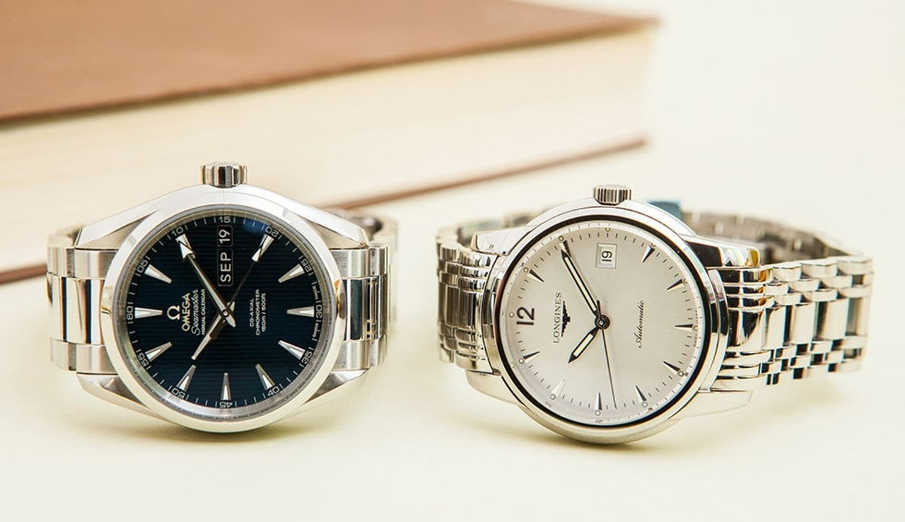 an Omega watch on the left and Longines on the right